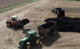 Three tractors in a field