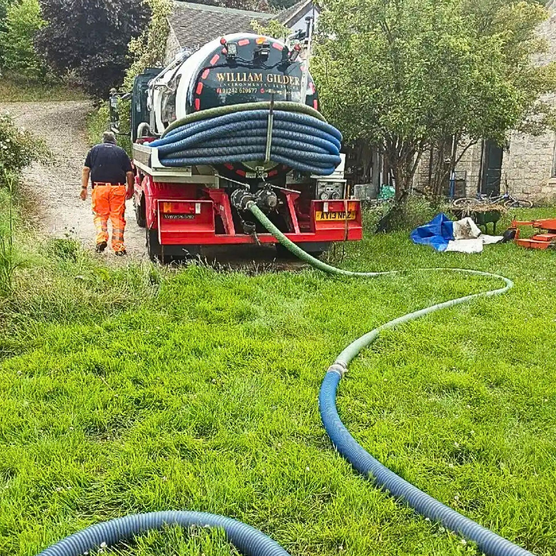 A sewage cleaning lorry, seen from rear