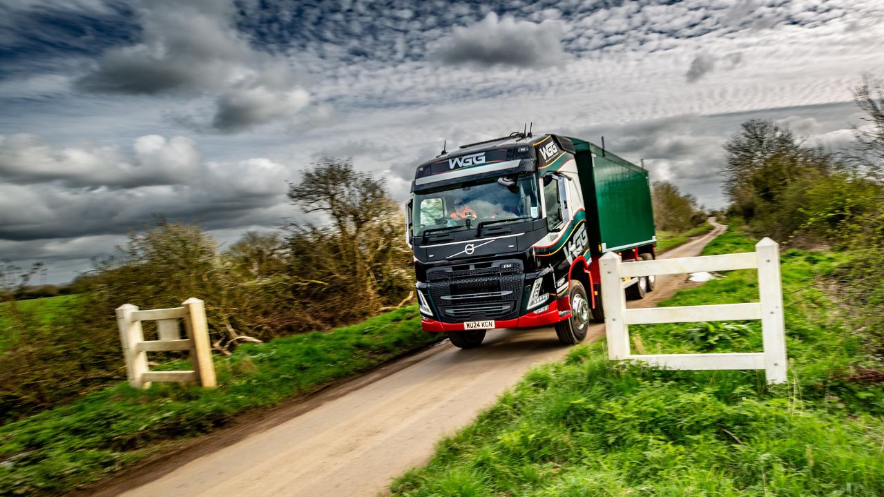 A lorry going through a gate